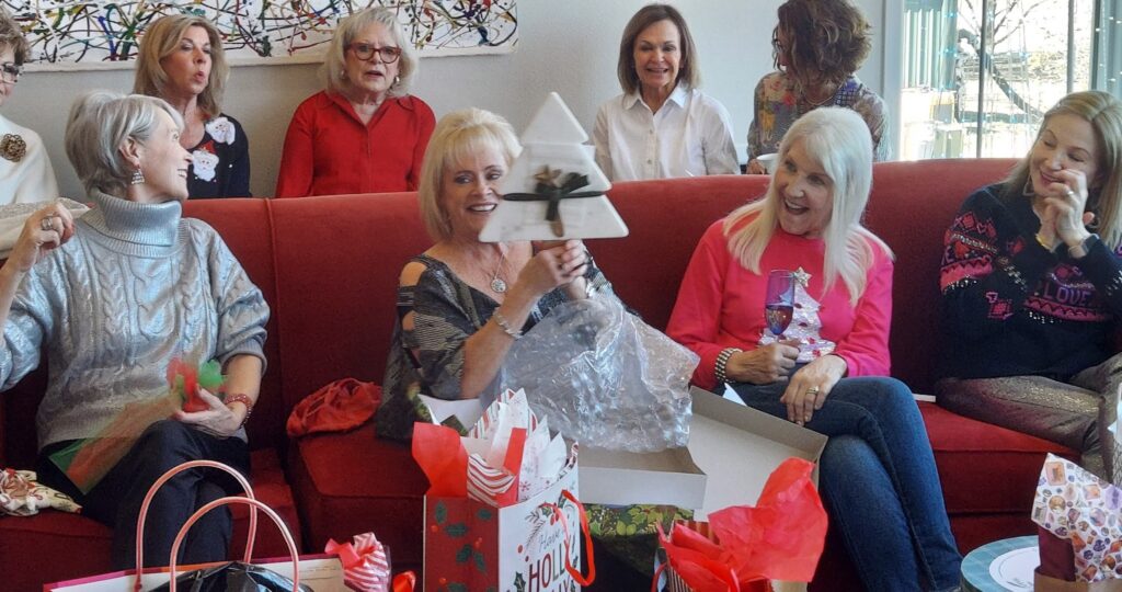 girlfriends opening Christmas gifts