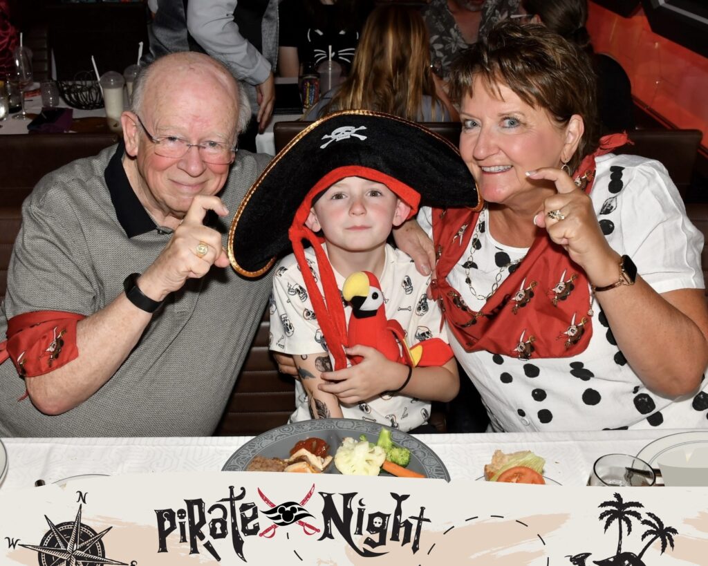 Grammy and Poppa with grandson dressed as a pirate