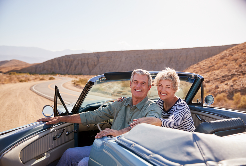 senior couple in convertible