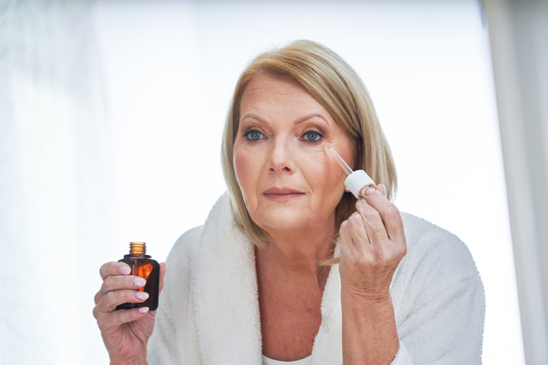 woman using anti wrinkle serum