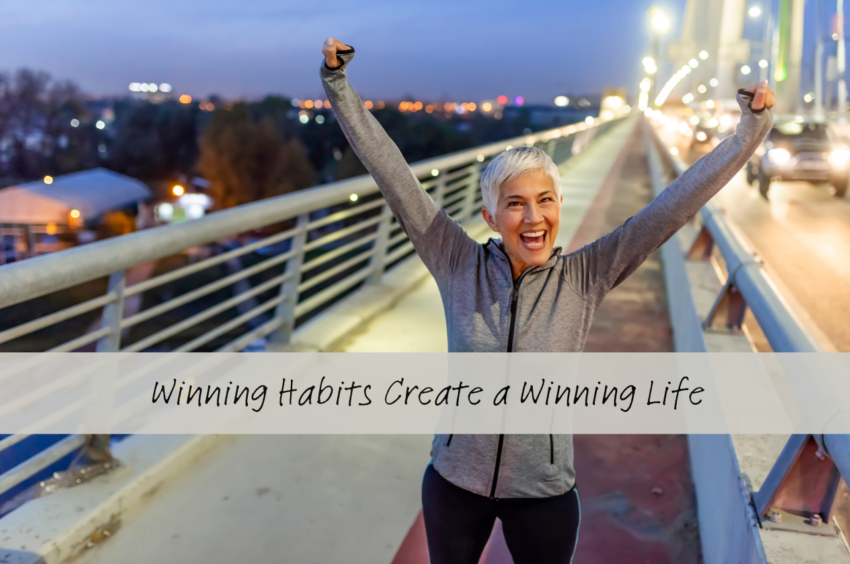 Woman with arms up, victory