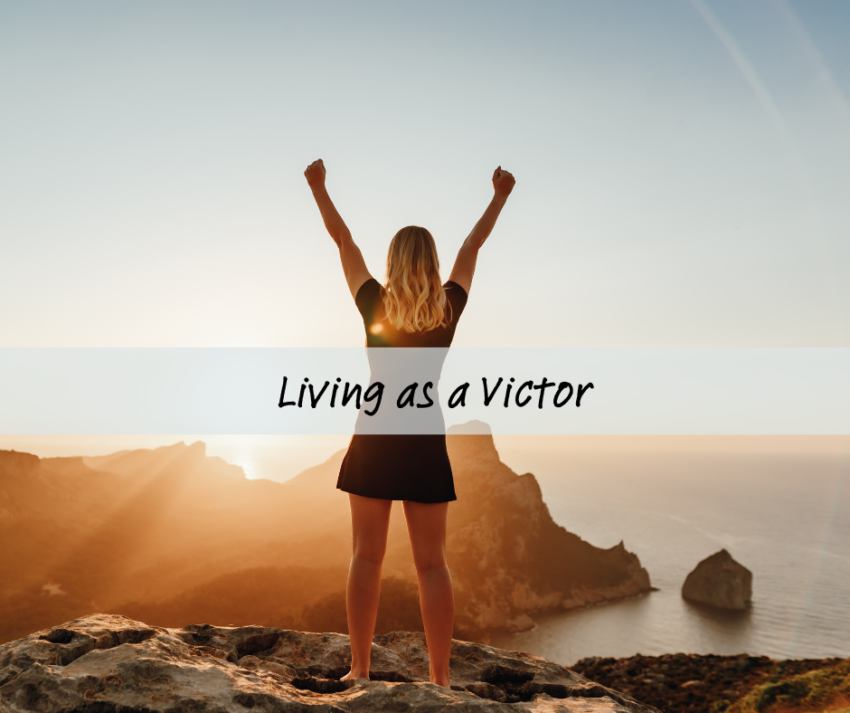 Woman with arms raised in victory