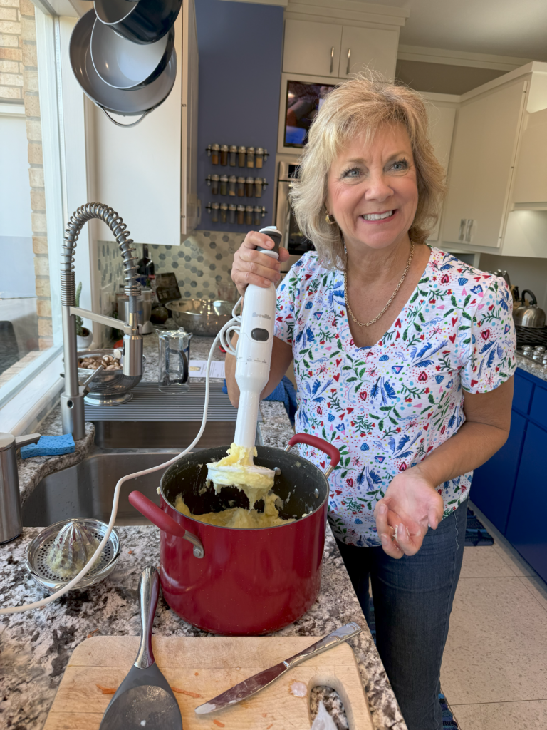 Marita mashing potatoes