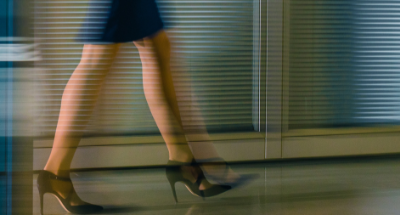 womens feet in high heels walking fast