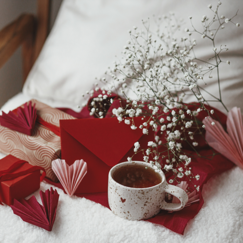 flowers, hearts and coffe eon a bed
