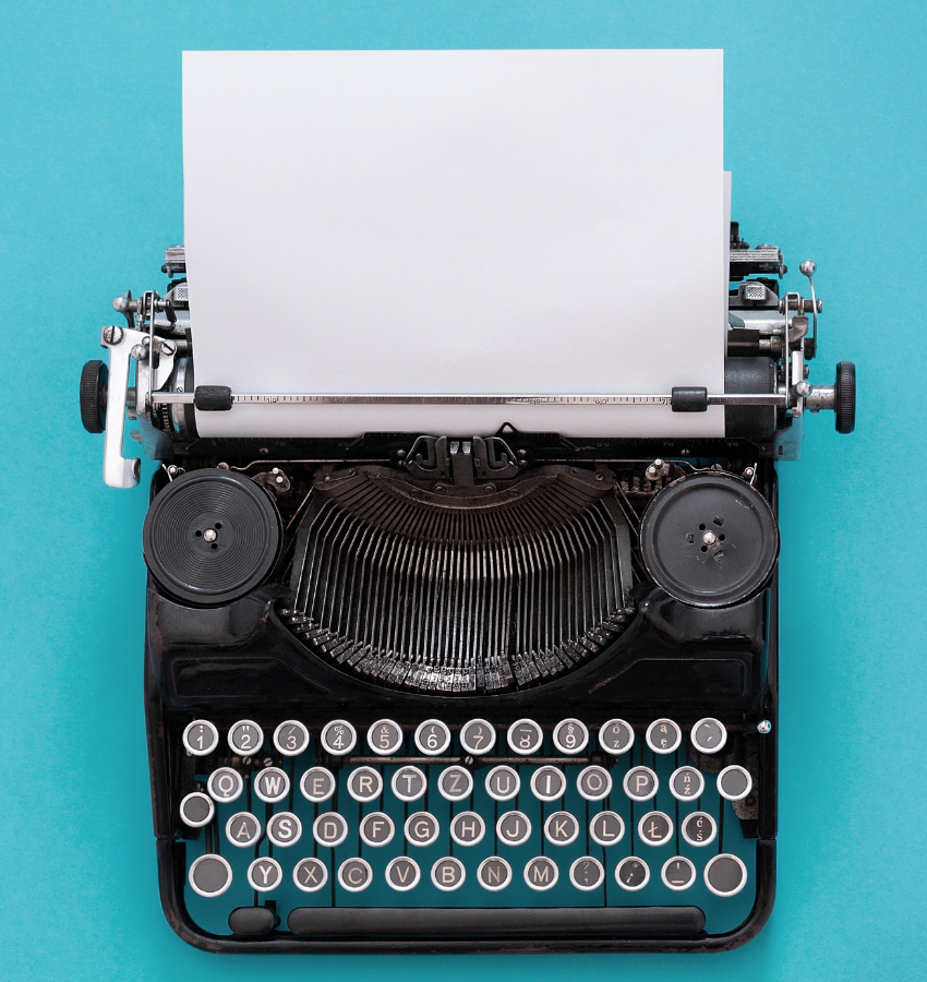 old typewriter with an empty page