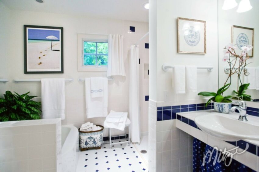 photo of a bathroom, white with blue accents