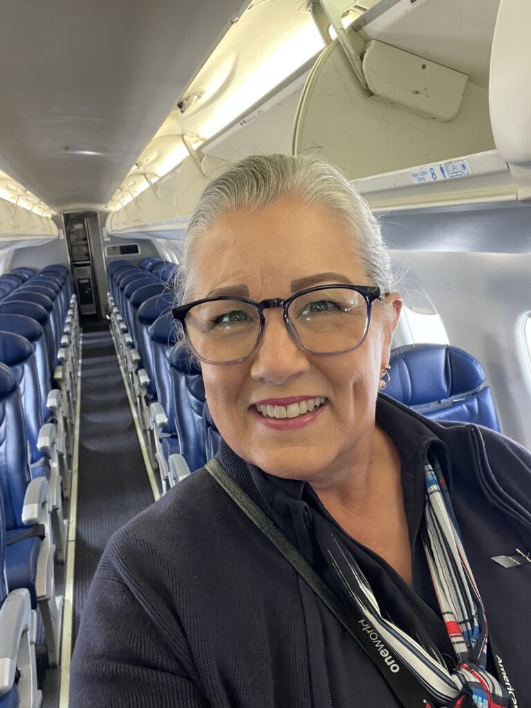 Christy as flight attendant