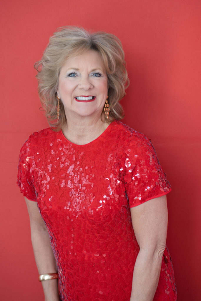 Mature blonde woman in red dress